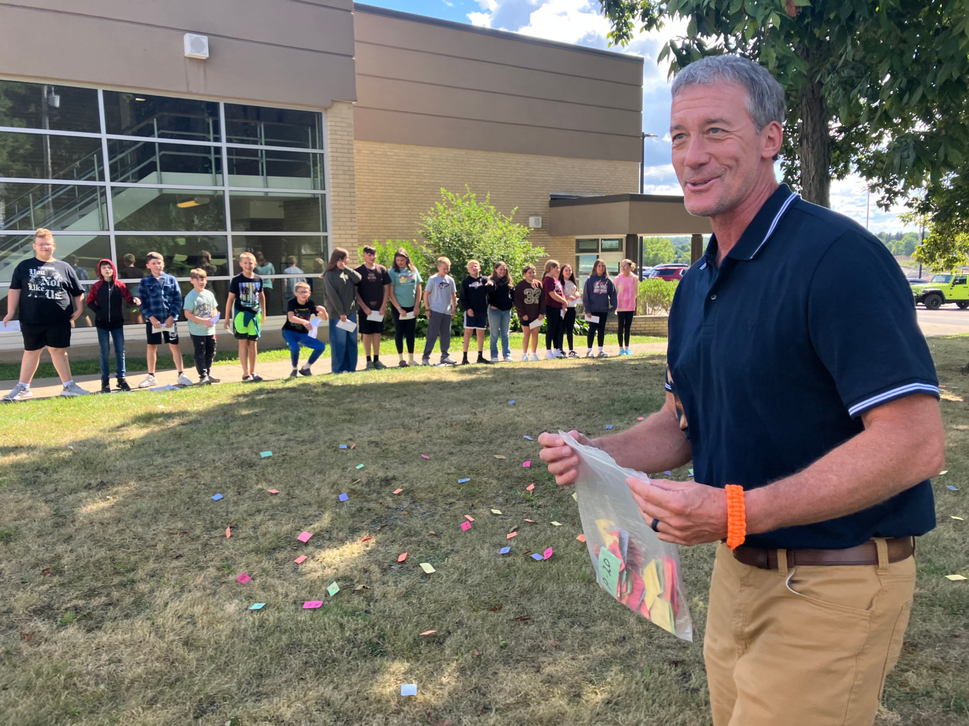 Mr. MacBeth explains a foraging activity with sixth grade students.